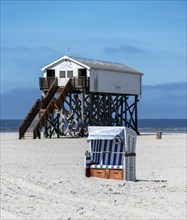 Beach chairs and signs on the sandy beach of the North Sea, Sankt Peter-Ording, Schleswig-Holstein,