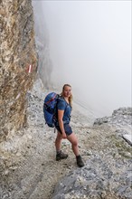 Hiker in the fog, Alpine dangers, Carnic Main Ridge, Carnic High Trail, Carnic Alps, Carinthia,