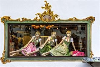 Shop window of fashion shop for traditional costumes, female mannequins, woman in dirndl, Wallgau,