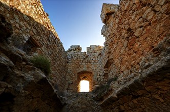 HDR, Interior view of the castle wall with a window-like hole through which sunlight enters,