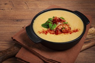 Pumpkin cream soup with shrimp, herbs and spices, homemade, no people