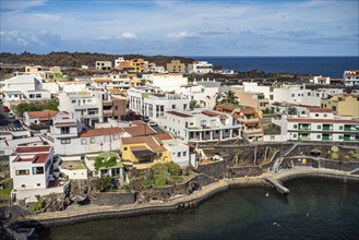 View from the Mirador El Tamaduste of the natural swimming pool and the village of Tamaduste, El