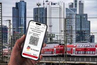 Symbolic image of Deutschlandticket, new from 2025 for 58 euros per month, ticket on mobile phone