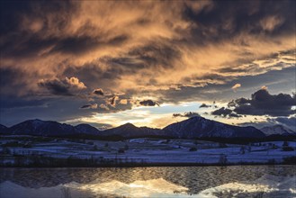 Cloudy mood, morning light, reflection of mountains in lake, icy, snow, winter, Riegsee, view of