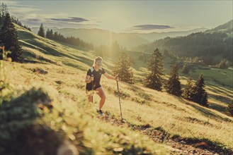 Summer trail running and hiking in the Alps on the Riedberg Pass between Obermaiselstein and