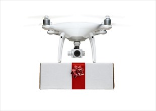 Unmanned UAV drone quadcopter delivering A package with a red ribbon and bow isolated on a white