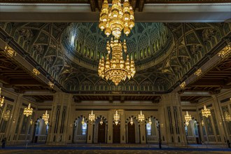 Interior, dome and illuminated chandelier in the Sultan Qaboos Mosque, Muscat, Arabian Peninsula,