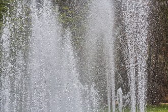 Water fountains, water features, spray mist, park in city centre, symbol photo, urban microclimate,