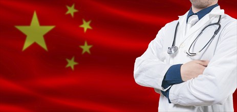 China Health Care concept. Male doctor on China flag. Doctor with crossed arms on China flag