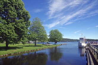 Canal-like still water and a wooden passenger ship, Haverud Aqueduct, Dalsland Canal, Västra