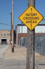 Detroit, Michigan, A road sign warns of a factory crossing