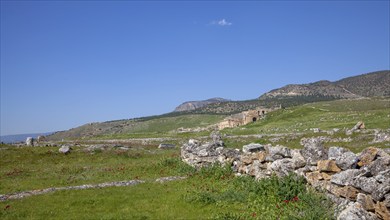 Remains, ruins in Hierapolis, in the background ruins of the ancient theatre Hieropolis, near