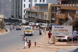 Traffic and pedestrians in the street of Kigali, capital of Rwanda, Central Africa