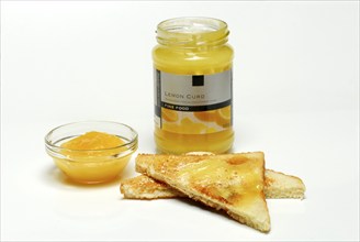 Lemon cream, in glass bowl, on toast, jam, lemon spread