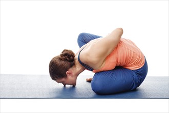 Woman doing Ashtanga Vinyasa Yoga stretching asana Marichyasana B, pose posture dedicated to sage