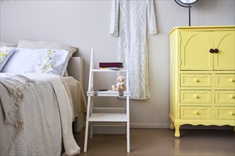 Use of folding stepladder chair in bedroom