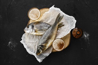 Whole jerky sea bass, dorado and a beer