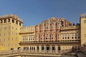 JAIPUR, INDIA, NOVEMBER 18, 2012: Tourists visiting Hawa Mahal palace (Palace of Winds), famous