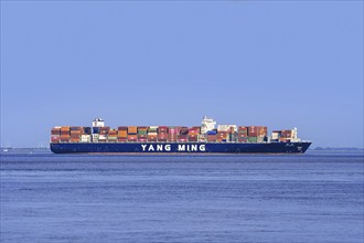 Chinese container ship, containership Yang Ming YM Wreath loaded with containers on the North Sea,