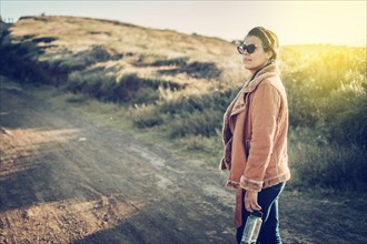 Close-up of a young woman on the road, Lifestyle of a Latin girl on a road outdoors. Portrait of a