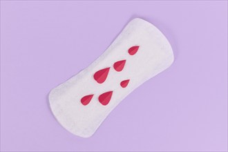 Female period concept with panty liner with symbolic paper blood