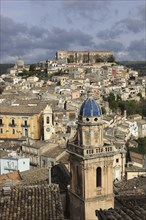 City of Ragusa, in front the steeple of the church of Santa Maria dell Itria, behind it the houses