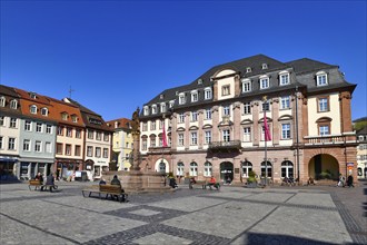 Heidelberg, Germany, April 2020: Market square with historic city town hall called Rathaus on sunny