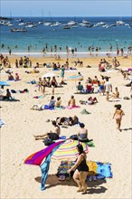 Crowded beach with people in August, San Sebastian, Donostia, Basque Country, Northern Spain,