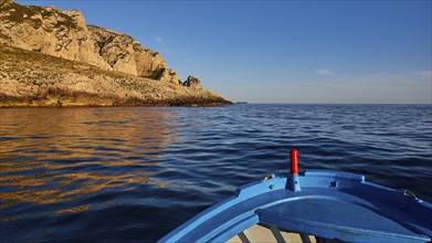 Evening light, boat tour, boat bow, view from the sea, bizarre rock formations, rugged mountains,