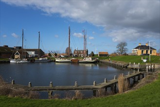 Ships in the harbour at Workum lock, Workum, Friesland, Fryslân, Netherlands