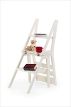 Foldable wooden chair transforming into stepladder on white background