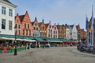 Bruges, Belgium, May 29, 2018: Bruges Grote markt square famous tourist place with many cafe and