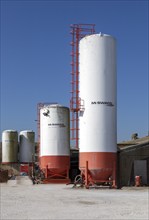 Storage tanks at Mi Swaco Minerals division, a Schlumberger company, Great Yarmouth, Norfolk,