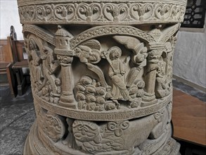 Romanesque baptismal font from 1129 in the former collegiate church of St. Boniface, relief