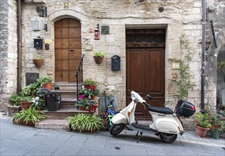 Vespa scooter in the streets of Assisi Old Town, Umbria, Italy, Europe