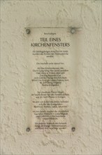 Information board, part of a church window, historical and partly destroyed church window,