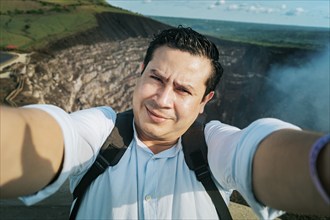 Adventurous people taking a selfie at a viewpoint. Close up of person taking an adventure selfie,