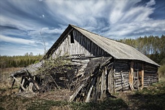 Old ruined abandoned rural house in countryside