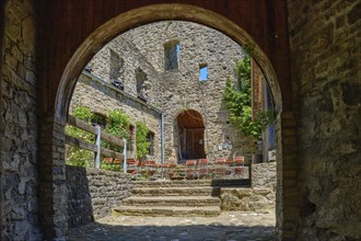 View through the castle gate into the castle courtyard, medieval castle ruins Sulzberg in Allgäu