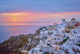 Famous greek iconic selfie spot tourist destination Oia village with traditional white houses and