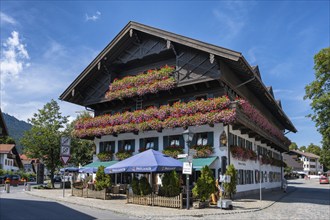 Historic half-timbered house with floral decorations, Oberammergau, Garmisch-Partenkirchen