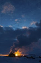 Mud pot with steam source at sunrise, Hverir solfataras field, fumaroles, snow-covered geothermal