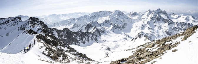 Ski tourers at the ski depot, view of snow-covered mountain panorama, view from Sulzkogel, behind