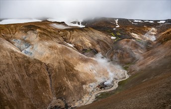 Steaming streams between colourful rhyolite mountains, Hveradalir geothermal area, Kerlingarfjöll,