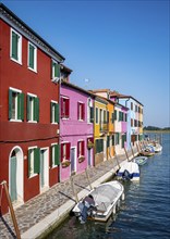 Canal with boats and colourful house facades, Burano Island, Venice, Veneto, Italy, Europe