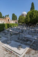 Graves, dome of St Christopher's Church at the back, San Michele cemetery island, Venice, Italy,