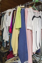 Women's clothes for sale inside second hand goods and chattels store, Quebec, Canada, North America