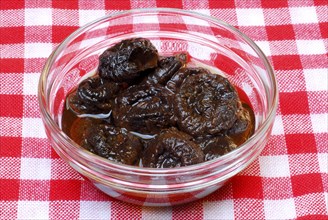 Plums, dried, soaked in water, prune