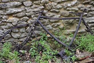 Remains of a burnt bicycle. The burnt village of Oradour-sur-Glane was destroyed on 10 June 1944