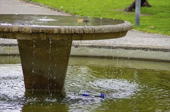 Disfigured fountain in the municipal park of Freiburg im Breisgau, Baden-Württemberg, Germany,